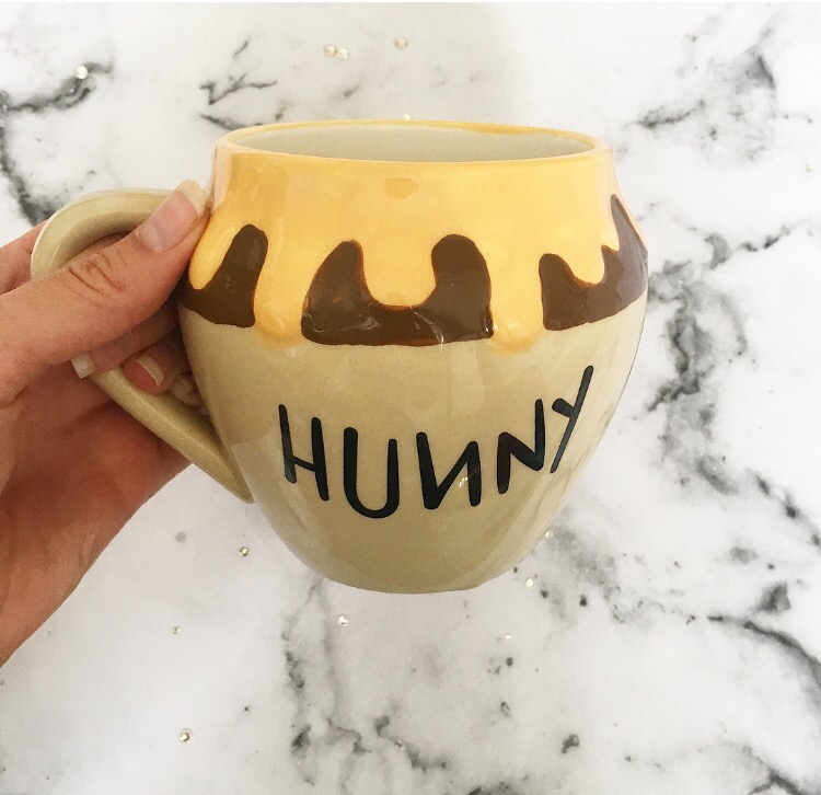 Winnie the Pooh honeypot shaped mug with honey spilling over the top and 'hunny' written on the front